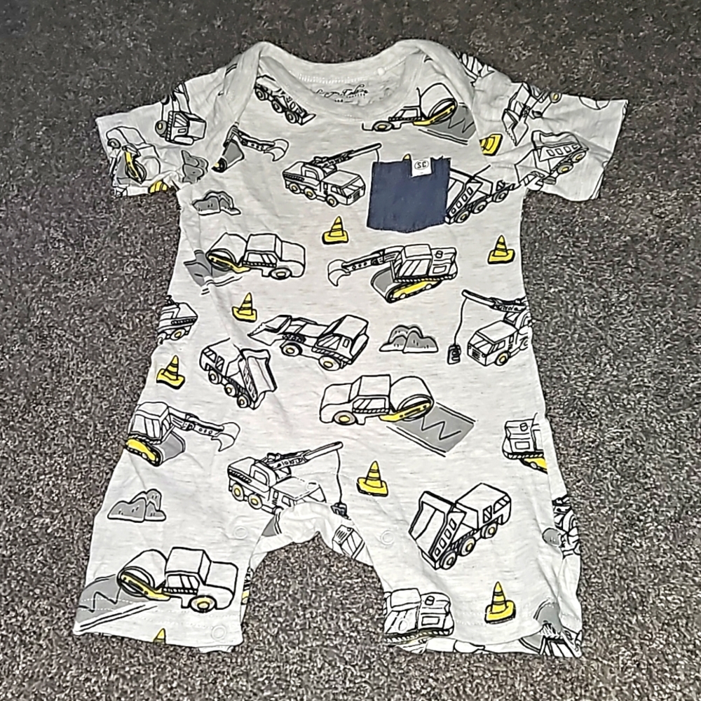 12 month construction themed jumper. Short sleeved with shorts.